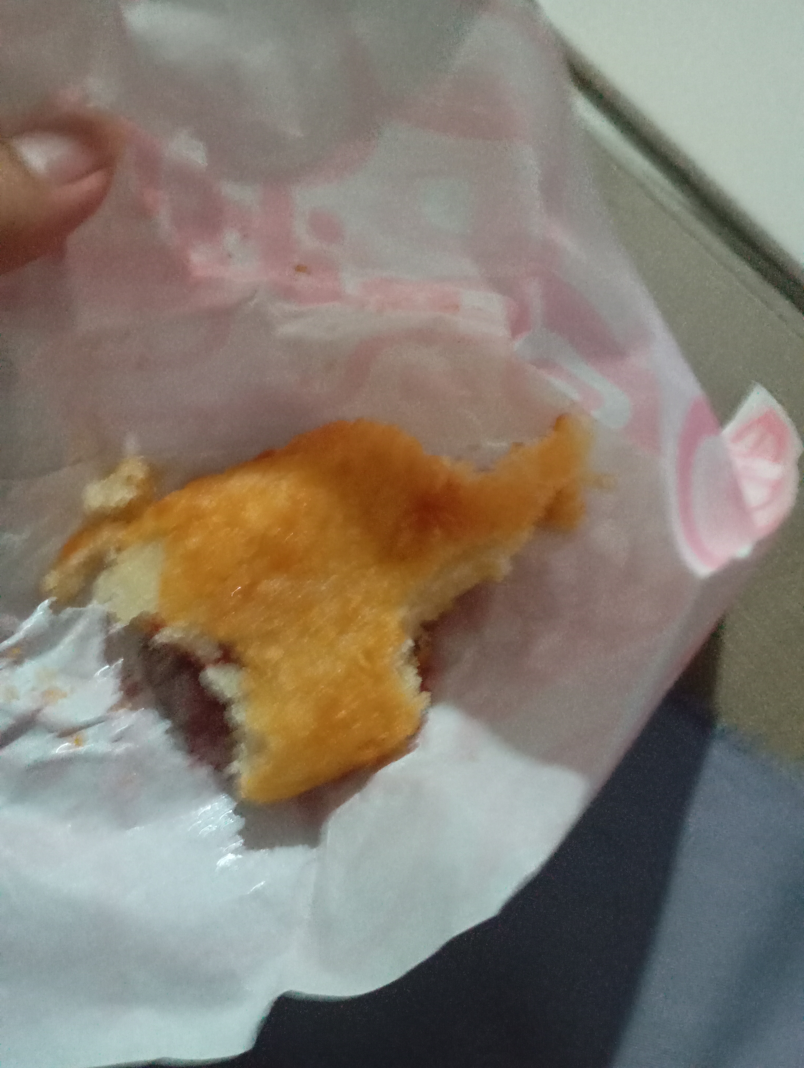 this is a korean corndog with a cheesy half and a meaty chicken hotdog at the bottom